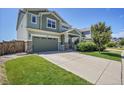 Charming two-story home showcasing a well-manicured lawn, inviting curb appeal, and a two-car attached garage at 428 Starline Ave, Lafayette, CO 80026