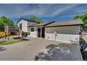 The home features a large deck area with a staircase, perfect for outdoor enjoyment at 9605 Carr St, Broomfield, CO 80021