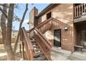 Exterior entrance showing the unit number, staircase, and front door at 540 S Forest St # 6-203, Denver, CO 80246