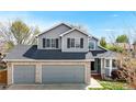 Charming two-story home with a two-car garage, gray siding, and a well-maintained front yard at 2314 Flagstaff Dr, Longmont, CO 80504