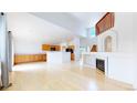 Bright open-concept living room and kitchen area, featuring light-colored wood floors at 2314 Flagstaff Dr, Longmont, CO 80504