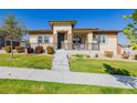 Charming one-story house with a landscaped front yard at 10761 N Montane Dr, Broomfield, CO 80021