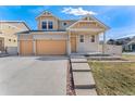 Beautiful home features a welcoming facade, two-car garage, and well-maintained landscaping in a desirable neighborhood at 18800 E 55Th Ave, Denver, CO 80249