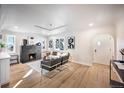Bright living room boasts a modern fireplace and ample natural light at 2380 Jasmine St, Denver, CO 80207