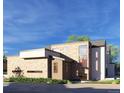 Modern home featuring a stone and white exterior, unique window design, and a well-maintained landscape at 1055 Greens Pl, Erie, CO 80516