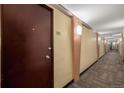 The hallway outside unit 705 features neutral wall colors, carpet, and sconce lighting at 1196 N Grant St # 705, Denver, CO 80203