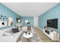 Modern living space with sofa and full bed, bathed in light from expansive windows at 1196 N Grant St # 705, Denver, CO 80203
