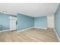 The living room has hardwood floors and blue walls at 1196 N Grant St # 705, Denver, CO 80203