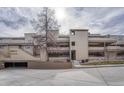 Modern multi-story condo building with visible balconies and a covered parking area at 2938 Kalmia Ave # 27, Boulder, CO 80301