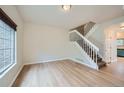 Bright living room boasts hardwood floors and a staircase leading to the upper level at 3033 W 107Th Pl # D, Westminster, CO 80031