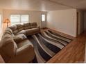 This inviting living room features a comfortable sectional sofa and stylish rug at 635 2Nd St, Bennett, CO 80102