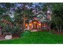 Charming brick home with lush green lawn, landscaped garden beds, and an inviting front entrance at 237 Lead King Dr, Castle Rock, CO 80108