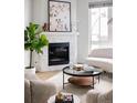 Modern corner fireplace with white stone surround at 2820 W 26Th Ave # 101, Denver, CO 80211