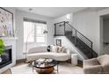 Stylish living room with a curved sofa and modern decor at 2820 W 26Th Ave # 101, Denver, CO 80211