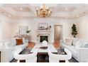 Comfortable living room with a fireplace, hardwood floors, and elegant decor at 4800 S Franklin St, Cherry Hills Village, CO 80113