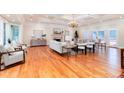 Expansive living room featuring hardwood floors, fireplace, and coffered ceiling at 4800 S Franklin St, Cherry Hills Village, CO 80113