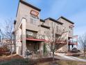 Well-maintained modern townhome showcasing architectural design and inviting outdoor living spaces at 8855 E 55Th Ave, Denver, CO 80238