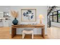 Elegant entryway featuring modern decor, a stylish desk, and natural light at 1085 S Cook St, Denver, CO 80209