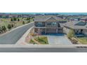 Two-story home with stone accents, spacious driveway, and landscaped front yard in a Gathering-friendly neighborhood at 2177 Shadow Creek Dr, Castle Rock, CO 80104