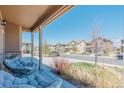 View from the porch showing neighborhood street with well-maintained houses and landscaping at 2177 Shadow Creek Dr, Castle Rock, CO 80104