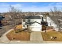 An aerial view of a two-story home with an attached garage, situated on a well-kept lot at 2715 E 131St Ave, Thornton, CO 80241