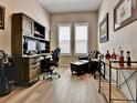 Comfortable home office space with built in desk and bright windows at 11464 Stonewash St, Littleton, CO 80125