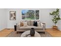 Comfortable living room featuring hardwood floors, and a large window at 9123 W Arbor Ave, Littleton, CO 80123