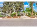 Charming home featuring stone accents, a well-maintained lawn, and a driveway with ample parking space at 404 S Jasmine St, Denver, CO 80224