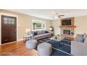 Inviting living room with hardwood floors, fireplace, and large window for natural light at 4293 Graham Ct, Boulder, CO 80305