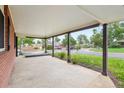 Spacious covered porch offering a relaxing outdoor space with a view of the neighborhood at 4293 Graham Ct, Boulder, CO 80305
