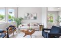 Bright living room with large windows, contemporary furnishings, and stylish decor at 4257 S Andes Way, Aurora, CO 80013