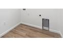 Newer laundry room features hard surface flooring at 18951 E 96Th Pl, Commerce City, CO 80022