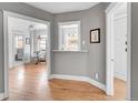 Cozy dining area adjacent to a modern kitchen, featuring hardwood floors and natural light at 215 E 11Th Ave # D8, Denver, CO 80203