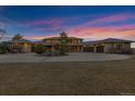 Beautiful home exterior features a circular driveway, stone accents, and attached garages at 5625 Twilight Way, Parker, CO 80134