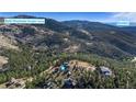 An aerial shot showcasing a property surrounded by trees, near to the Bald Mountain Scenic Area and in close proximity to Boulder at 319 Camino Bosque, Boulder, CO 80302