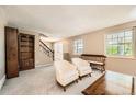 Bright living room featuring neutral carpet, white trim, and multiple windows for ample natural light at 3150 Lane Ct, Boulder, CO 80305