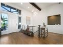 Inviting entryway with a hardwood floor, a large window, and stylish decor at 16486 Florawood Pl, Monument, CO 80132