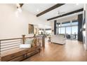 Bright loft featuring wood floors, modern railings, and scenic views at 16486 Florawood Pl, Monument, CO 80132