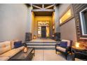 Cozy front patio area with comfortable seating and a fire pit at 16486 Florawood Pl, Monument, CO 80132