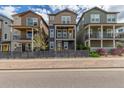 Attractive homes featuring covered balconies and fenced yards, offering stylish outdoor living spaces at 8953 Southurst St, Littleton, CO 80129