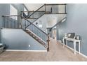 Inviting home foyer with staircase and tasteful decor at 5404 Fawn Ridge Way, Castle Rock, CO 80104