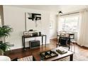 Comfortable living room featuring stylish décor, hardwood flooring, and natural light from the window at 4422 W 27Th Ave, Denver, CO 80212
