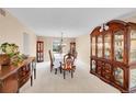 Formal dining room with a large table, elegant chairs, and decorative cabinet at 6005 S Jamaica Way, Englewood, CO 80111