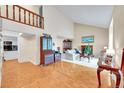 Spacious living room featuring high ceilings, a fireplace, and wood floors at 6005 S Jamaica Way, Englewood, CO 80111