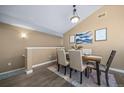Cozy dining area with hardwood floors and stylish wall art at 8626 Gold Peak Dr # B, Highlands Ranch, CO 80130