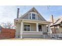 Charming two-story home with a covered front porch and attractive architectural details at 3825 Tejon St, Denver, CO 80211