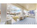 Inviting covered front porch with classic columns and a view of the neighborhood at 3825 Tejon St, Denver, CO 80211