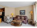 Comfortable living area showcasing a sofa, patterned armchair, and well-appointed furnishings at 640 Village Rd # 4220, Breckenridge, CO 80424