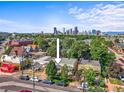Aerial view of property showcasing the house, neighborhood, and downtown skyline in the distance at 1024 34Th St, Denver, CO 80205