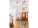 Bright foyer featuring high ceilings, wood floors, a decorative rug and front door with sidelights at 1437 Cassin Ct, Boulder, CO 80303